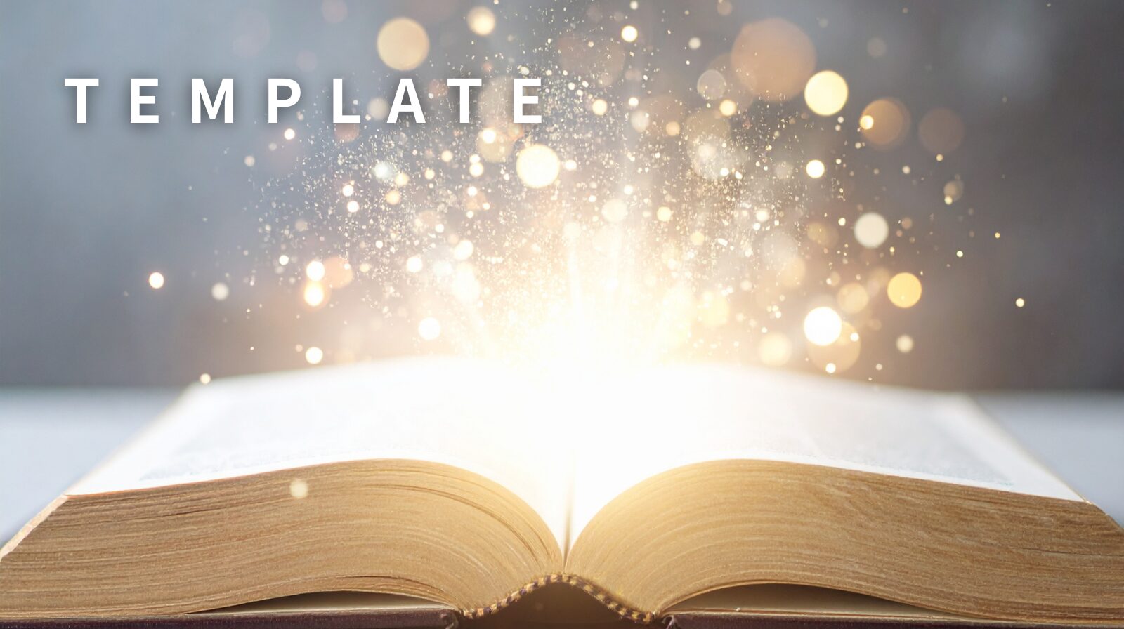 開いた本が輝いている左上に「TEMPLATE」と記載されている画像